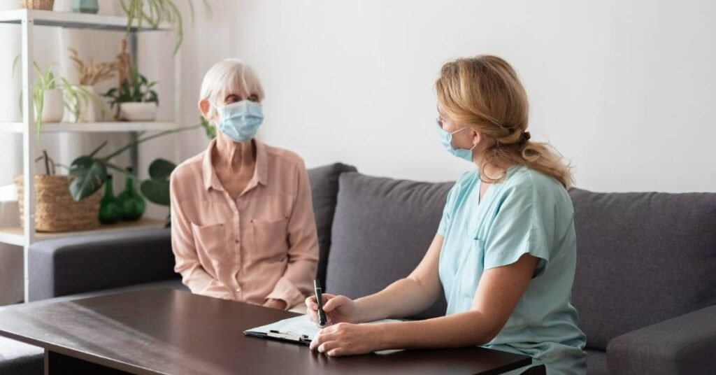 Home care assessment visit in Pennsylvania showing a caregiver discussing care needs with a senior at home to create a personalized home care plan